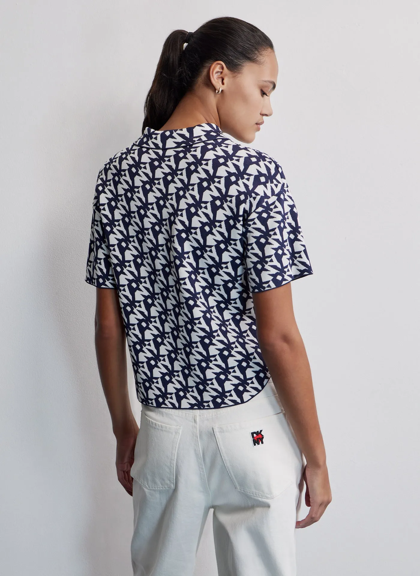 POLO WITH KNITTED ALLOVER LOGO