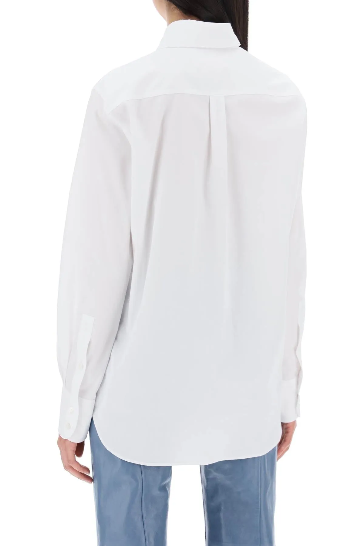 "shirt with flower print patch and embroidered logo